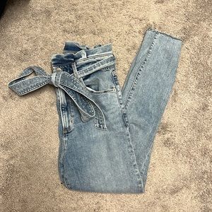 Light denim high waisted skinny jeans with denim bow belt!